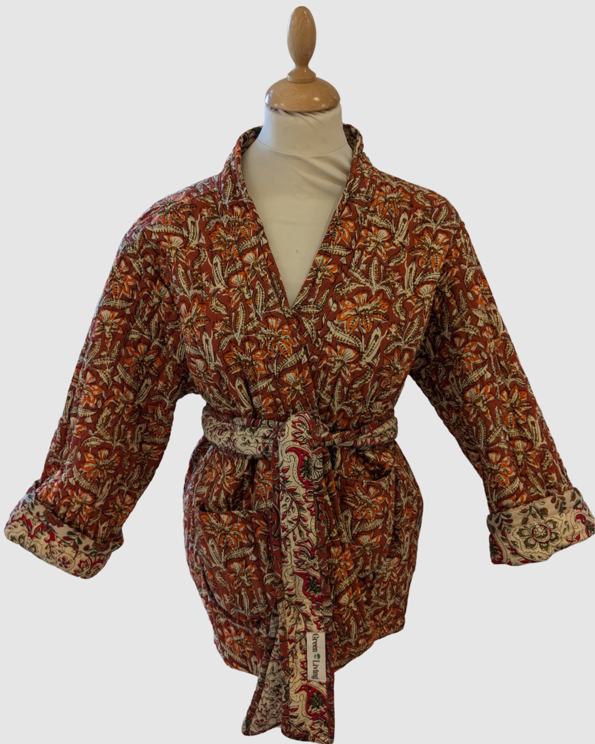 Vendbar quiltet jakke fra Indien - Sand/orange blomstret